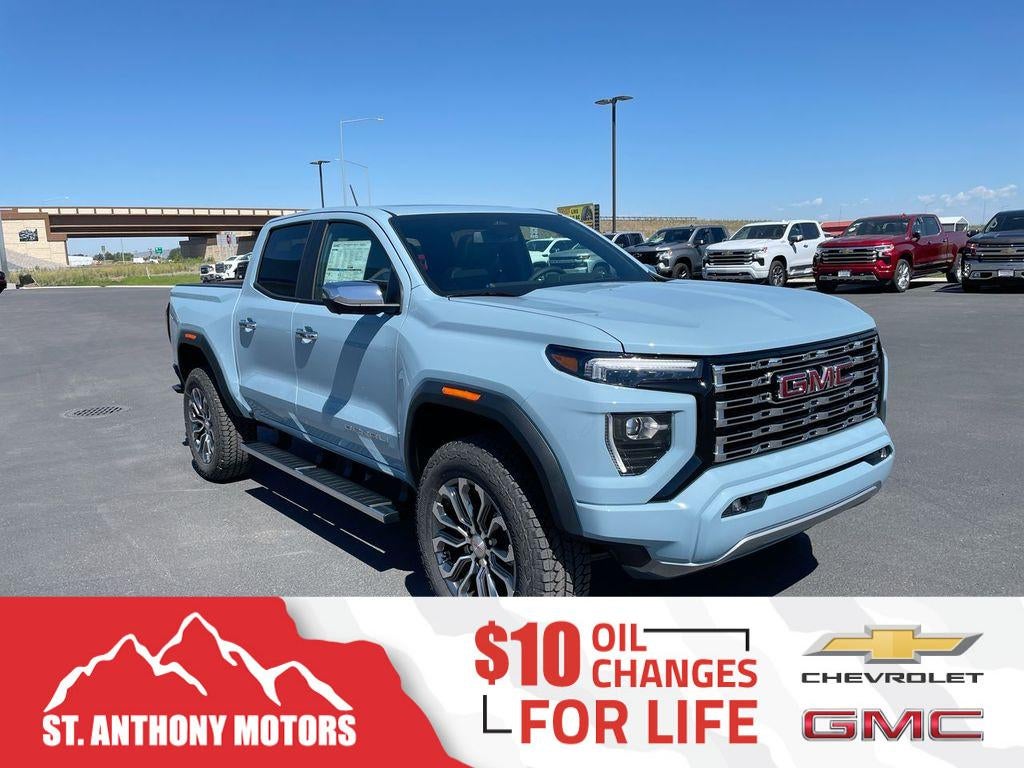 2026 GMC Canyon Denali in Glacier Metallic — front three-quarter view
