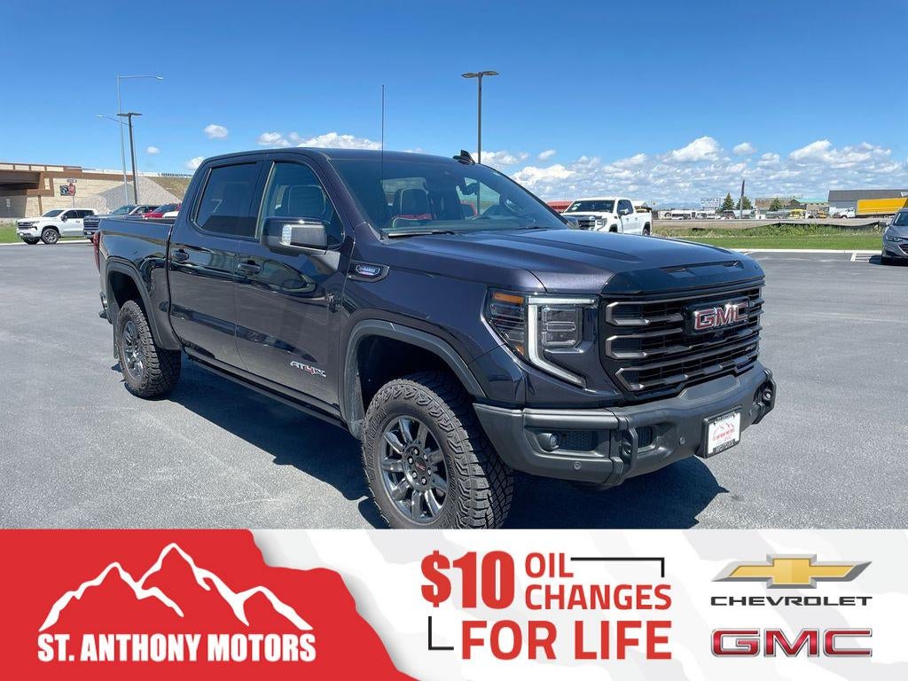 2026 GMC Sierra 1500 AT4X in Titanium Rush Metallic — front three-quarter view